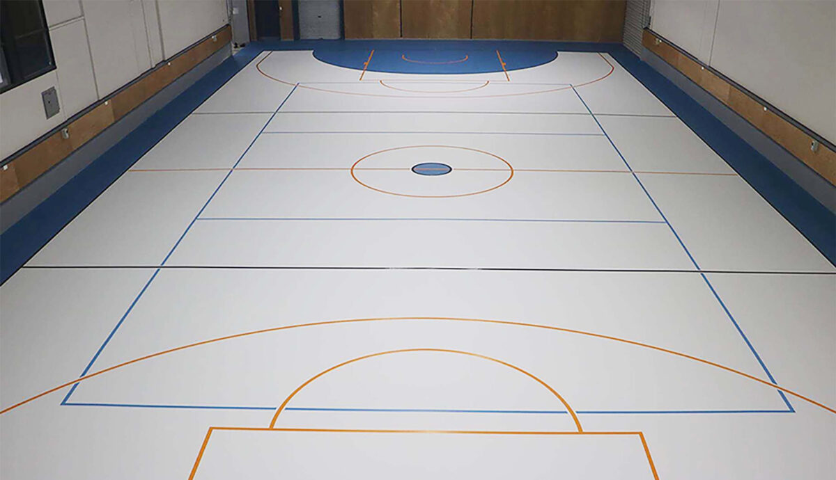 Herculan MF Blue 28 court at Te Kopuku High in Hamilton, light grey playing surface with navy blue end zones and orange futsal marking
